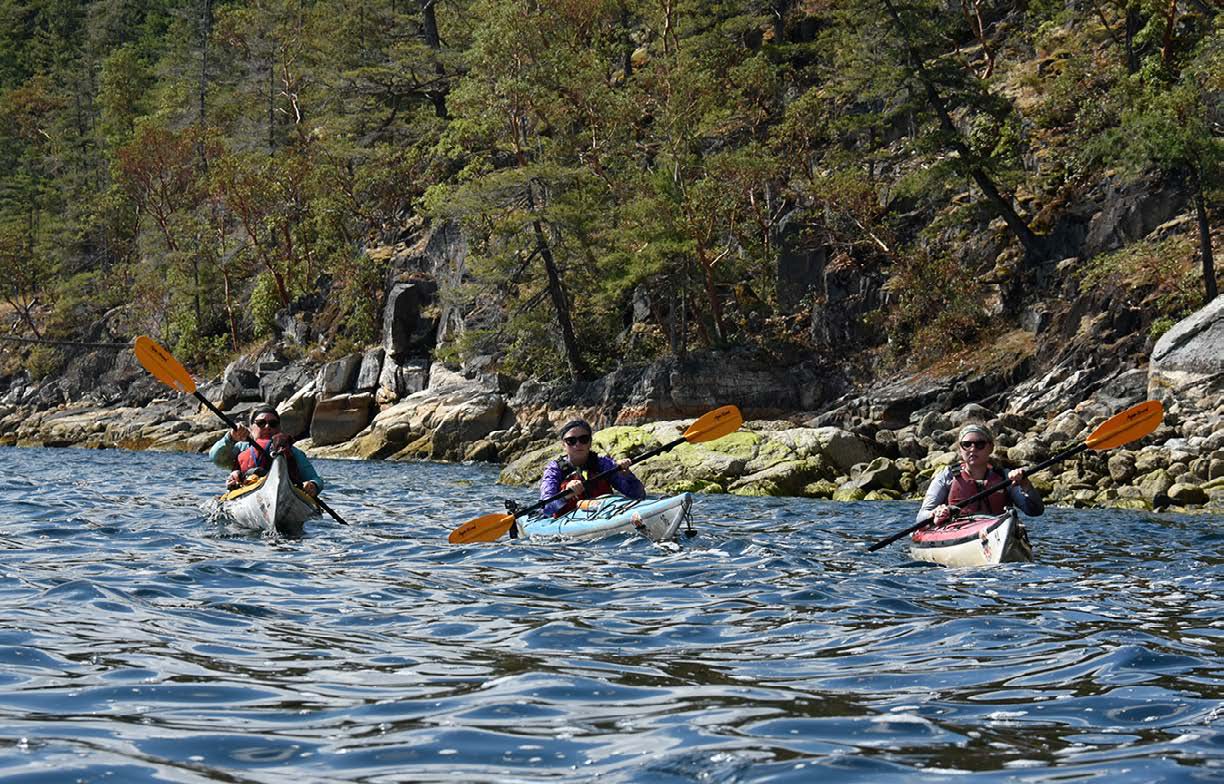 Paddling sea kayaks near B.C.’s Coastal Mountains