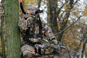 hunter wearing safety harness