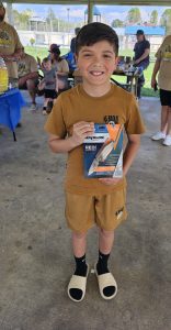 "Award ceremony at the Roscoe Spaulding Memorial Turkey Hunt, with hunters receiving prizes of a Havalon knife 