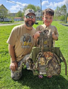 "Award ceremony at the Roscoe Spaulding Memorial Turkey Hunt, with young hunters receiving a turkey vest as a prize