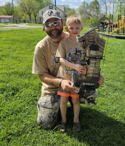 "Award ceremony at the Roscoe Spaulding Memorial Turkey Hunt, with hunters receiving a compound bow as a prize