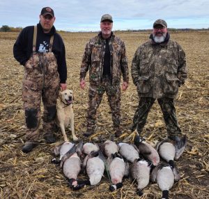 Fowler Guide Service staff Keith, Gord and Ace with Bill in the field 