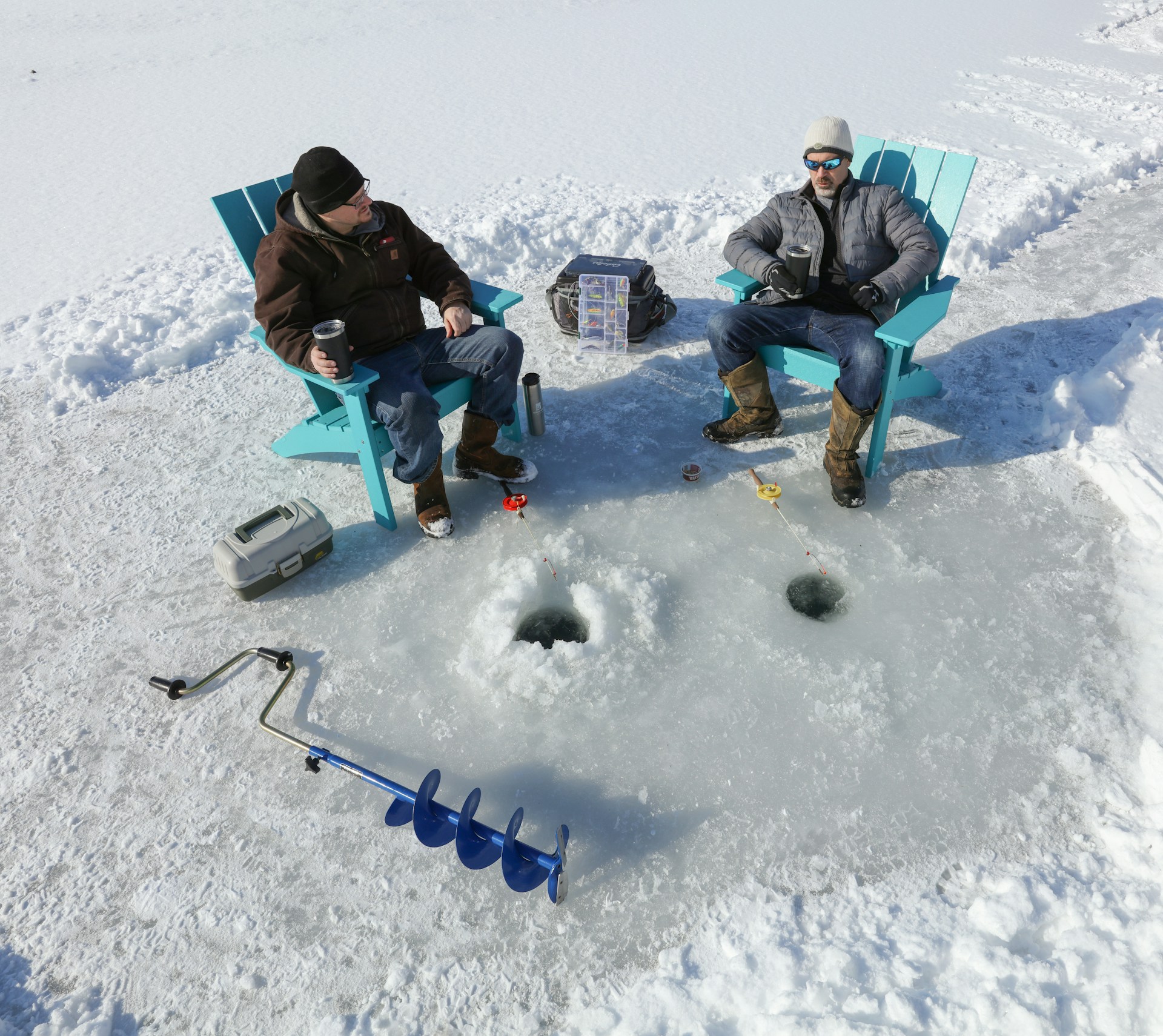 drilling ice fishing hole
