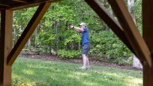 Shooter practicing with the Mantis Titan X during an outdoor dry-fire session
