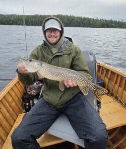 Angler with a very large northern pike on an Ontario Fly-in fishing trip