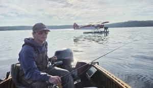 float plane taxiing away from the dock on an Ontario Fly-in fishing trip