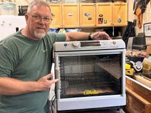 Author Brad Fenson with his pick for best high capacity budget dehydrator.